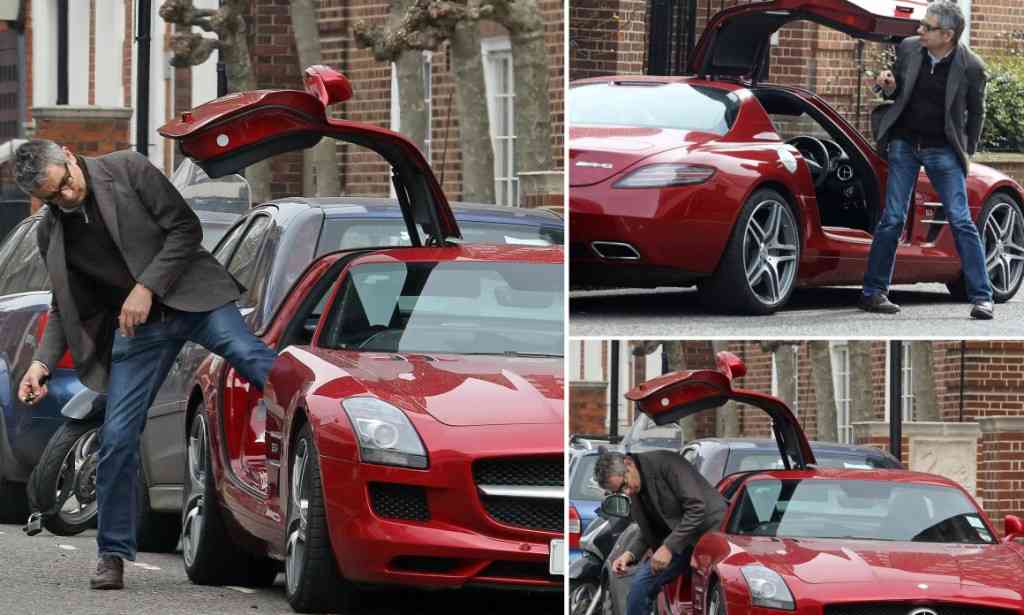 Rowan Atkinson seen lowering himself into Mercedes SLS | Mail Online