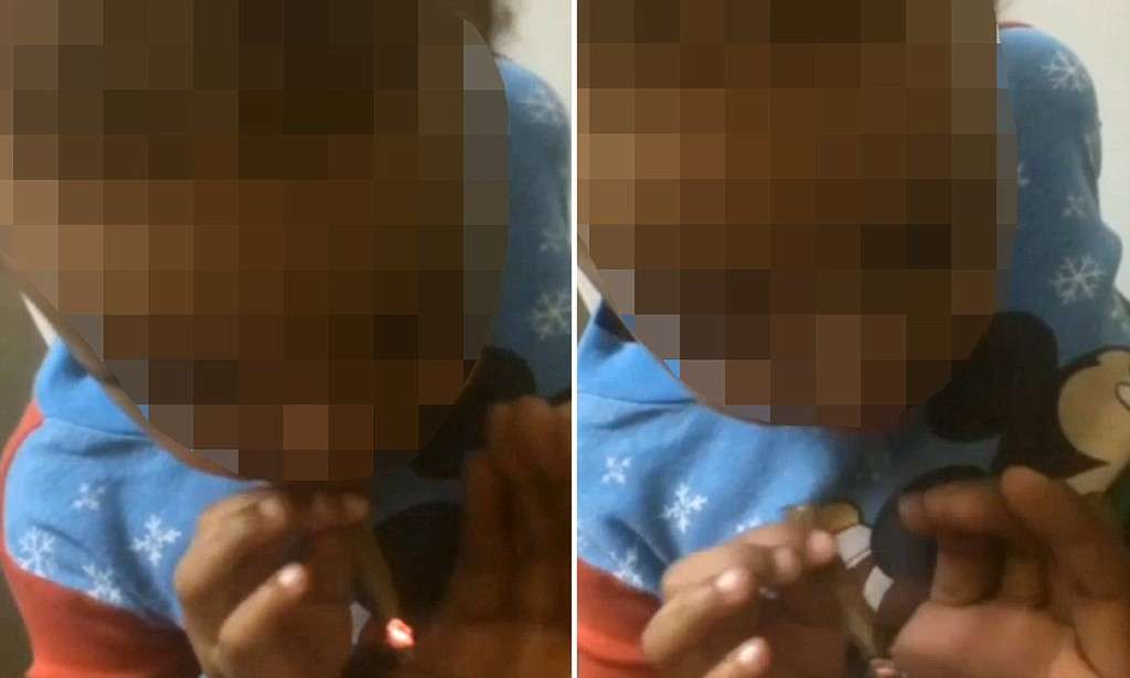 Toddler seen 'smoking marijuana' as 'adults are heard laughing' in SHOCKING video | Mail Online