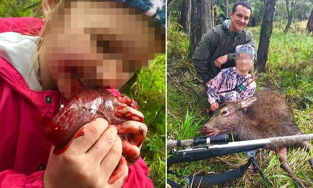 New Zealand hunting dad defends pictures of little girl biting a deer's HEART | Daily Mail Online