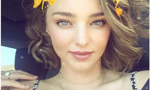Miranda Kerr flashes her giant diamond ring after engagement to Evan Spiegel | Daily Mail Online