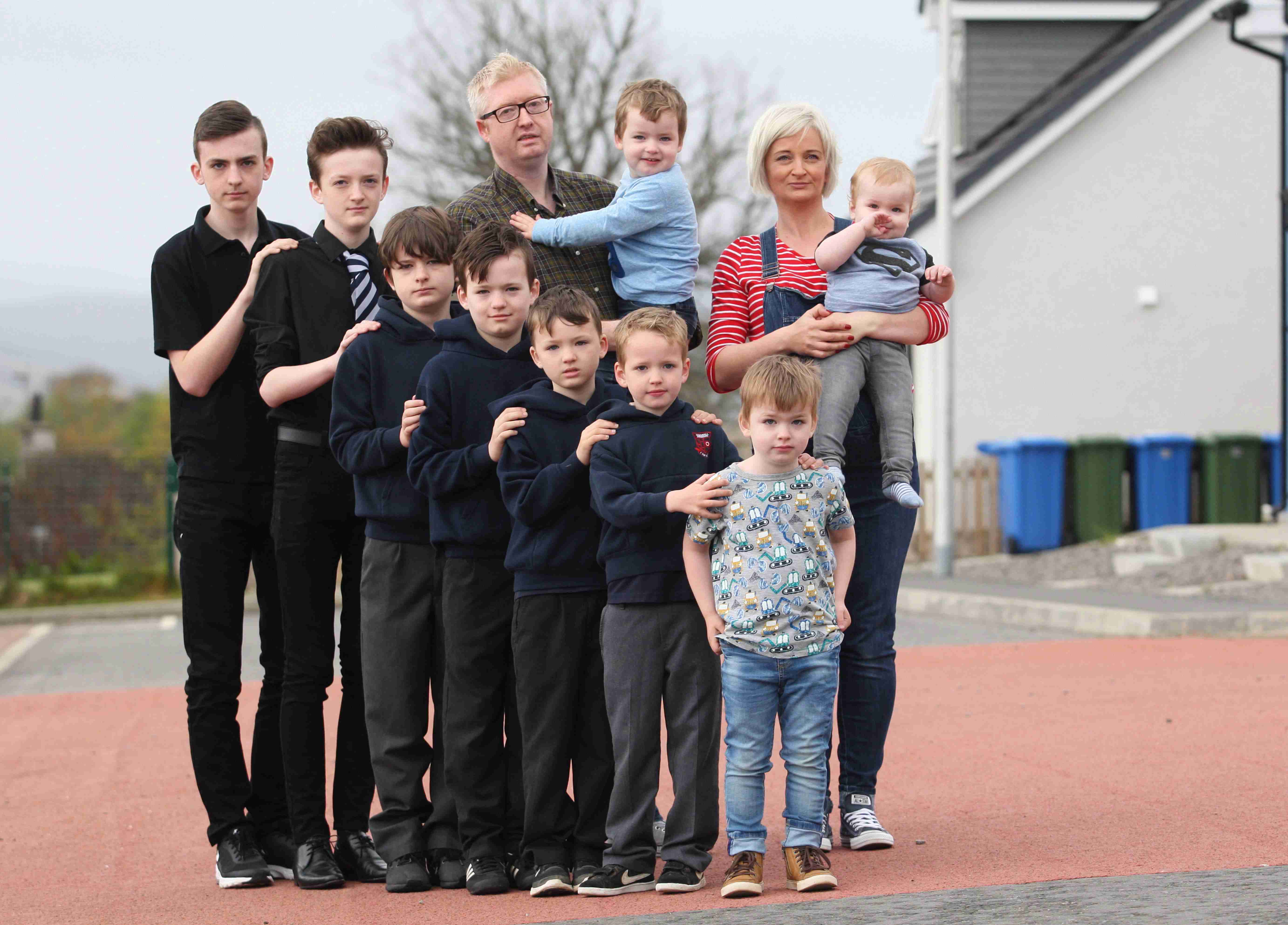 Mum of nine boys is pregnant again with her TENTH son - and she reveals they go through 84 pints of milk every week