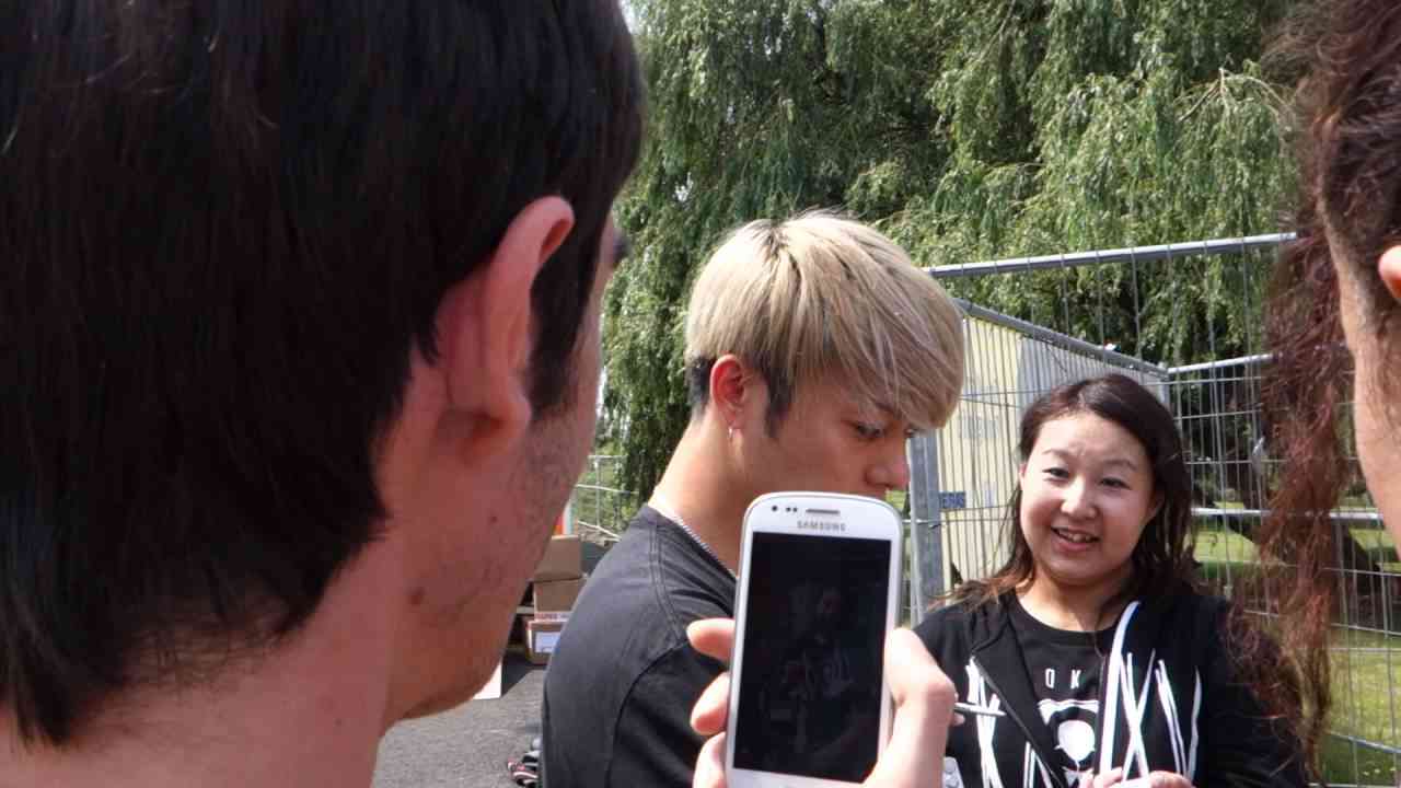 TORU OF ONE OK ROCK (ワンオクロック) TAKING SELFIES W/ FANS @ TRIX IN ANTWERP by Nowayfarer 