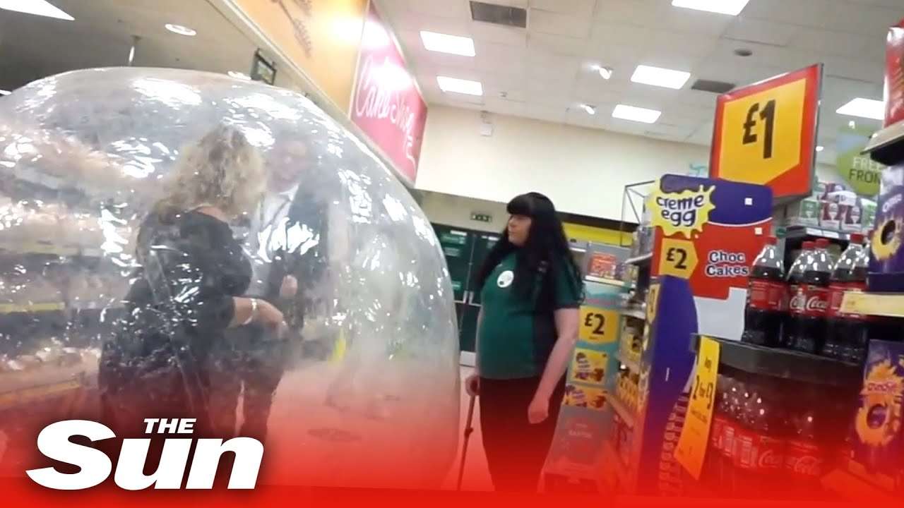 Weird world of coronavirus Britain as woman shops in zorb ball at Morrisons - YouTube