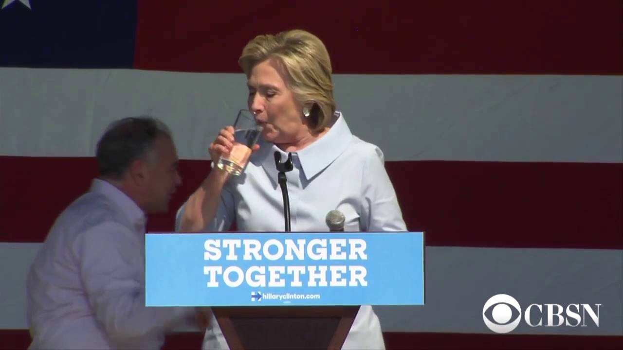 Hillary coughs mystery substance into water glass - YouTube